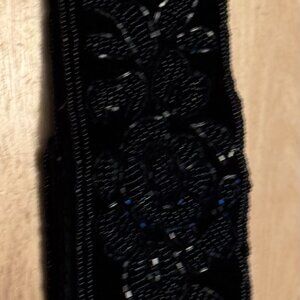 Velvet hand beaded belt with velcro closure. Size 8-10.